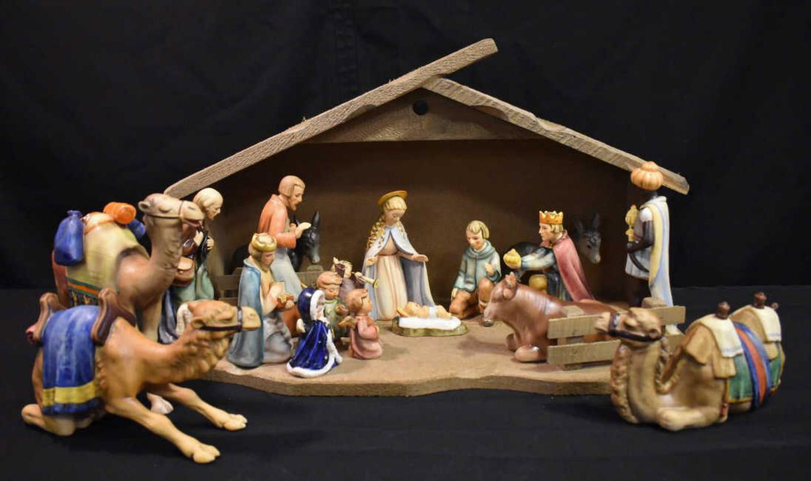 Hummel Nativity Set: Hummel Nativity Set. Eighteen piece set ranging from 2 3/4" to 8 1/4"h. Includes two part barn. Three of the pieces are repaired.