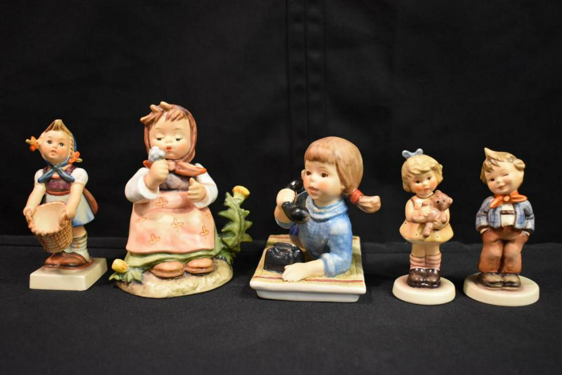 Group Of Hummel Figurines: Group Of Hummel Figurines. Total of 5 figurines in the group. Consists of Scamp. Little Helper. Cuddles. Make A Wish. Talking On The Phone. Sizes range from 3 1/2"-5" tall.