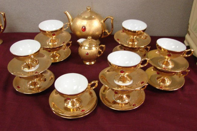Rieber Mittertaich Bavarian Gold Tea Set: Rieber Mittertaich Bavarian Gold Tea Set, tea pot with lid, 11 cups and saucers, creamer and lid (probably from sugar bowl), gold with red jewels.