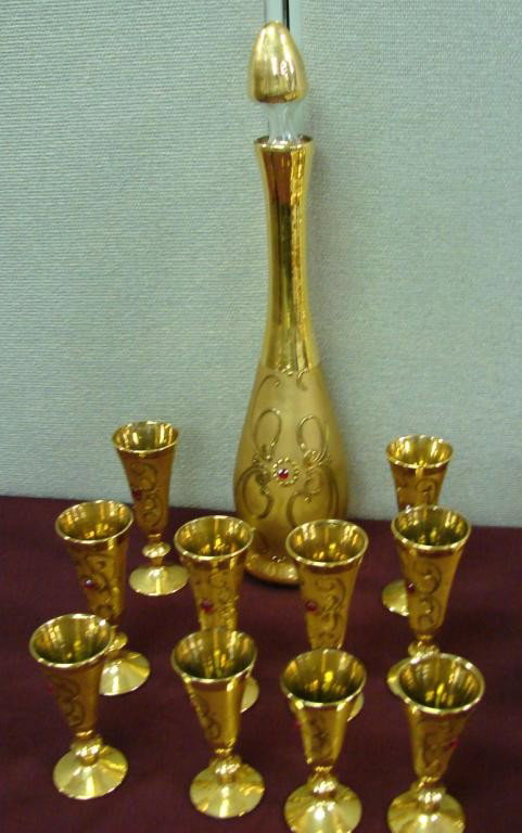 Rieber Bavarian Gold Decanter & 10 stemmed glasses: Rieber Gold Bavarian Decanter and 10 stemmed glasses decorated with red jewels.