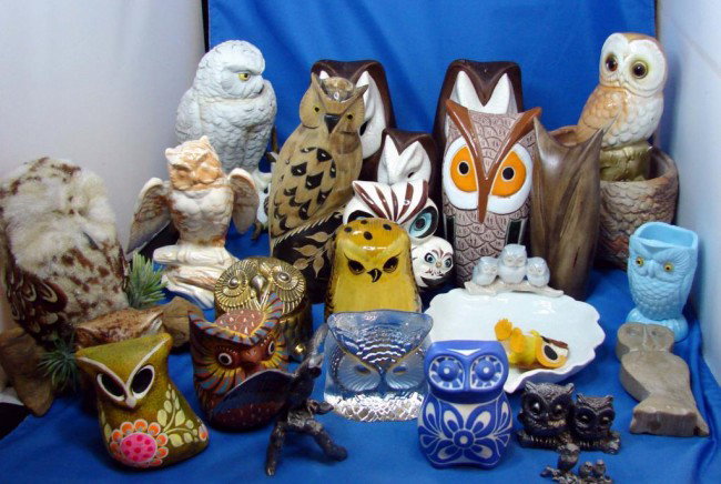 Lot of 25+ Owls including Carved Buffalo Horn: Box Lot of Owls including one made of Carved Buffalo Horn from Thailand, a brass music box, marble, ceramic, pottery, etc.