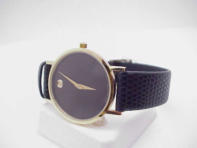 Man's Movado Museum watch: Man's Movado Museum watch with goldtone case ,black dial, swiss movement and black leather band. NEW!