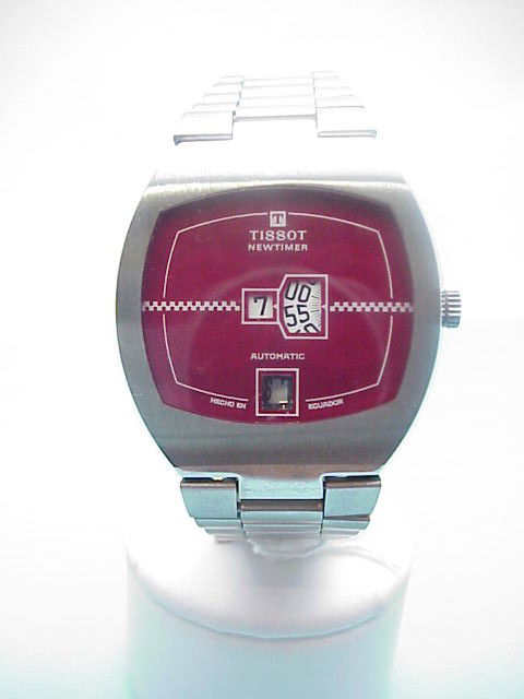 Man's Tissot Newtimer automatic watch: Man's stainless Tissot newtimer with red dial. automatic movement and has windows to show day, date and time. NEW