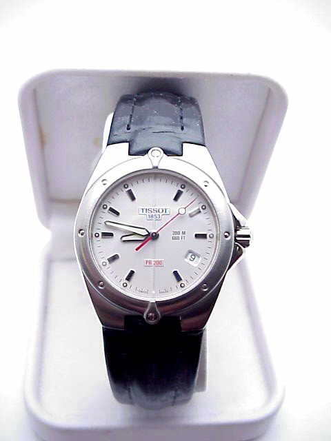 Stainless Tissot watch with leather: Stainless Tissot watch for men or woman has a silver stick dial, quartz Swiss movement, calendar and black leather band. NEW!