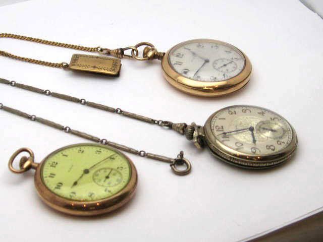 Lot of 3 Elgin pocket watches: Lot of 3 Elgin pocket watches gold filled with fobs.