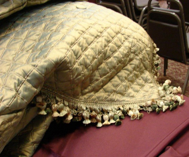Designer King Bedspread w/ball fringe + bolsters : Designer silk fabric king size bedspread, custom made for consignor, trimmed with ball fringe, 2 tapestry bolsters, trimmed in matching fringe, and 2 European Pillows. Orig. $8,000.