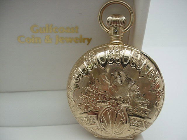 14kyg Elgin pocket watch: Beautiful 14kyg Elgin pocket watch 55 grams totally reconditioned with white roman face and second hand inset and beautifully engraved with birds and floral designs.