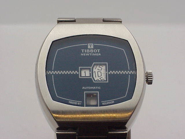 Man's stainless Tissot Newtimer automatic: Man's stainless blue dial Tissot Newtimer automatic has individual windows for hour, minute and calendar. Brand new.