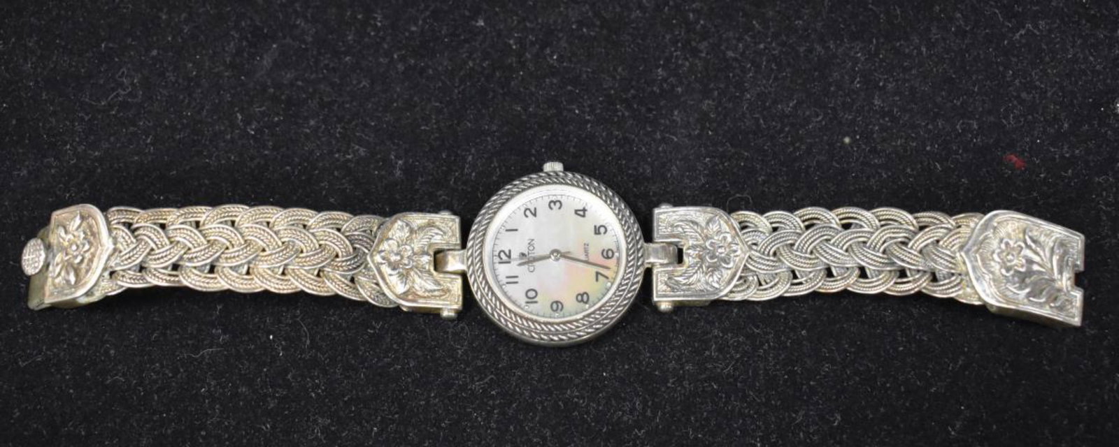 Ladies Croton Sterling Silver Watch & Ban: Croton Ladies Watch Mother of Pearl Dail Sterling silver watch and band. New battery. Measures 7 1/2 inches long and band is 1/2 inches wide. Weighs 71 grams total weight. Watch case is sterling with 