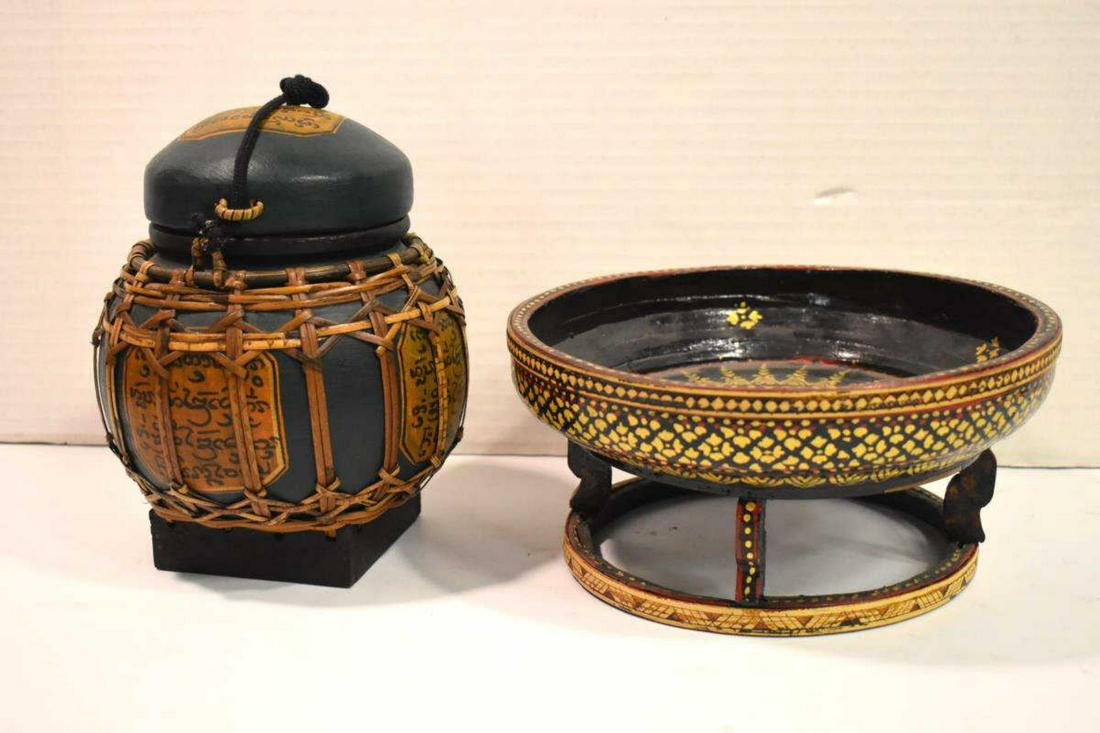 Pair of Burmese Hand Crafted Wooden Bowls: Burmese Black Lacquer Offering Bowl Hand Crafted & Painted. 4" tall & 8" diameter. Also Includes a Burmese Hand Crafted Lidded Wooden Bowl With Woven Bamboo Or Wicker Outer Cover. Flat green colored w