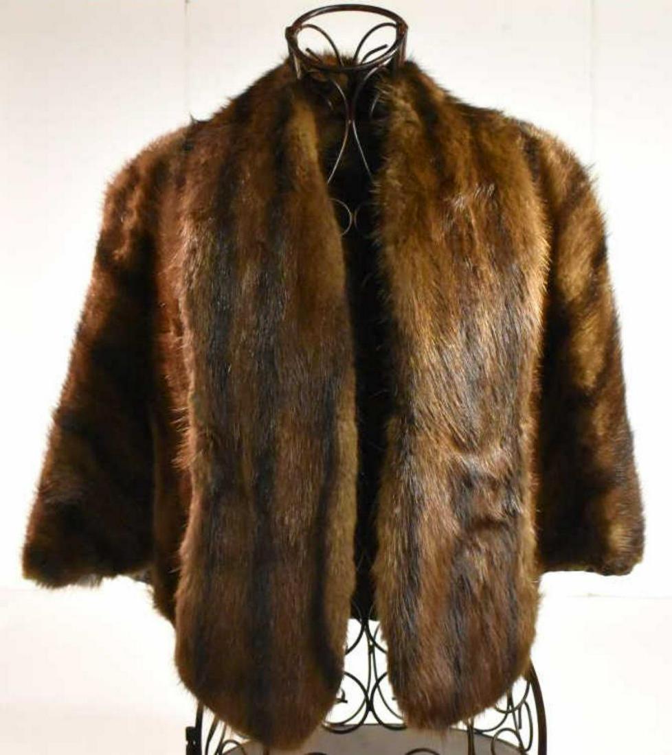 Mink Jacket: Mink Jacket. Meyer Jonasson Altoona, PA. Dark brown color Fur Mink. Has straps inside the coat for support of shoulders and arms. Measures 17" from shoulder to shoulder. Measures 23" shoulder down.