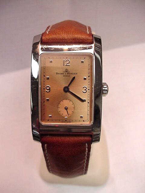 Stainless Baume Mercier watch: Man's stainless Baume Mercier watch with rectangular copper dial, second hand inset, and tan leather band. Like new!