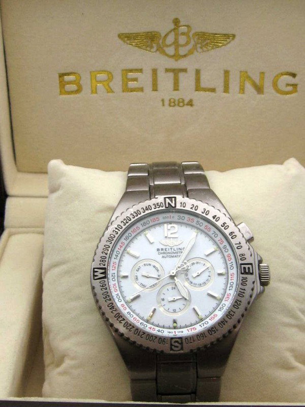 Stainless Breitling Chronograph watch: Man's stainless Breitling Chronographe Etanche, 50mm dive, day date dials, automatic movement model #A68062 with box.