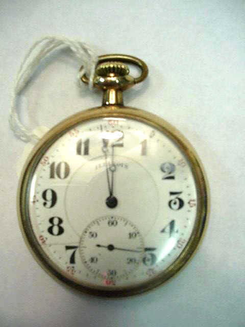 Open faced Illinois pocket watch: Illinois open faced pocket watch with white dial and second hand inset and good running condition.