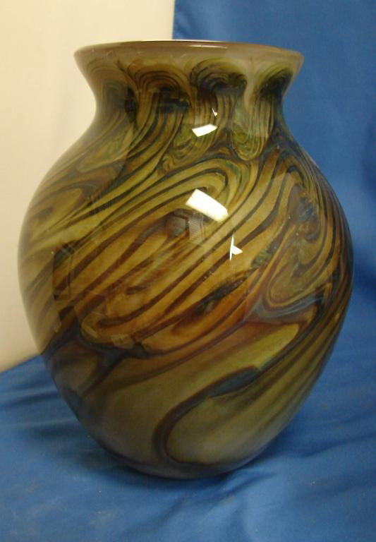 Signed Art Glass Vase in Blue & Brown Swirls: Signed Jacobs - art glass vase in swirls of blue, gold, green and brown; 10" tall, no chips or cracks.