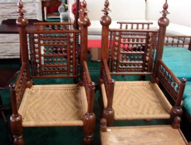 Pair Vintage Rosewood Chairs with Woven Jute Seat: Pair of Vintage Shesham wood, aka Indian Rosewood, Chairs with Woven Jute Seats, 22" x 21" x 47" to top of finial.