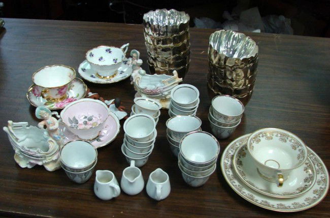 Box Lot: Russian Turkish Coffee Cups, Silver Bowls: Box lot of porcelain Turkish coffee cups, 2 hand painted figurines, 12 silver fluted bowls (not marked), English porcelain tea cups & saucers. Sold As Is.