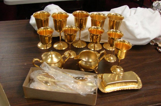 10 Gold Plated Goblets & Svc. for 8 Flatware: 10 gold plated goblets, in 2 sizes, sugar, creamer and covered butter; 50 pc. Rogers service for 8 in gold plated flatware, never used.