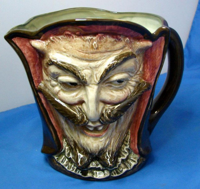 Royal Doulton Large Toby Jug Mephistopheles w/vers: Royal Doulton Large Toby Jug Mephistopheles, 5.75" tall, modeled by Charles Noke, verse on bottom ..When the devil was sick, the devil a saint would be...",no chips or cracks.