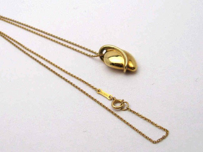 18kyg Elsa Peretti Tiffany pendant: 18kyg Elsa Peretti designed necklace for Tiffany & Co.6gr with gold wrap around and 16" chain.