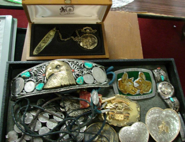 Lot of Men's Belt Buckles incl. Harley, Eagles, et: Lot of men's belt buckles including Harley Davidson, German silver heart, huge 8" wide buckle with an eagle, several lariats, Colibri lighter in orig. box, etc.