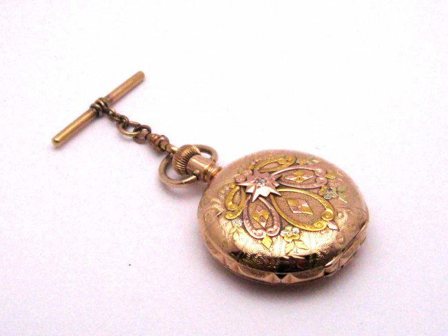 14kg pocket watch 1895 with diamond: Vintage 14k Elgin tri gold pocket watch from 1895 white enamel dial black roman #s, date, gold filigree hands,15jewel,rose,green and yellow gold filigree case with diamond star. Good working condition