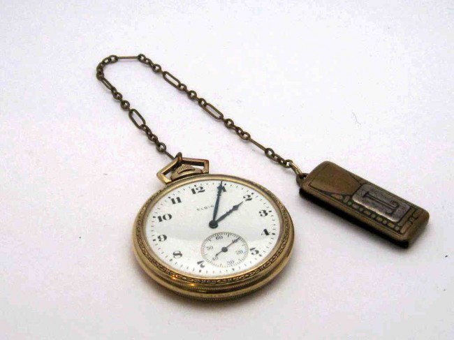 Open face Elgin pocket watch: Elgin open faced pocket watch white dial and second hand inset,17jewel, bronze & sterling fob and good working condition.