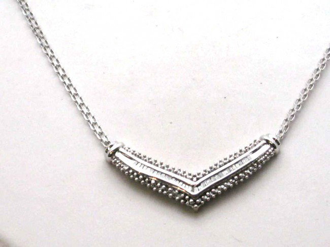 10kwg diamond chevron necklace: V shaped diamond necklace 7.3gr with prong set round and channel set baguette diamonds 1ctw with 16" Bismarck chain.