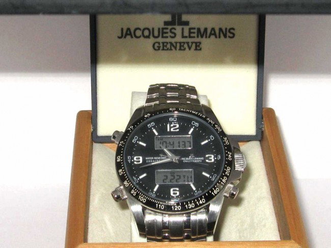 Stainless Jacque Lemans Chronograph: Jacque Lemans stainless digital chronograph watch charcoal dial,digital windows, tachymeter bezel,dive to 250m original box and papers.
