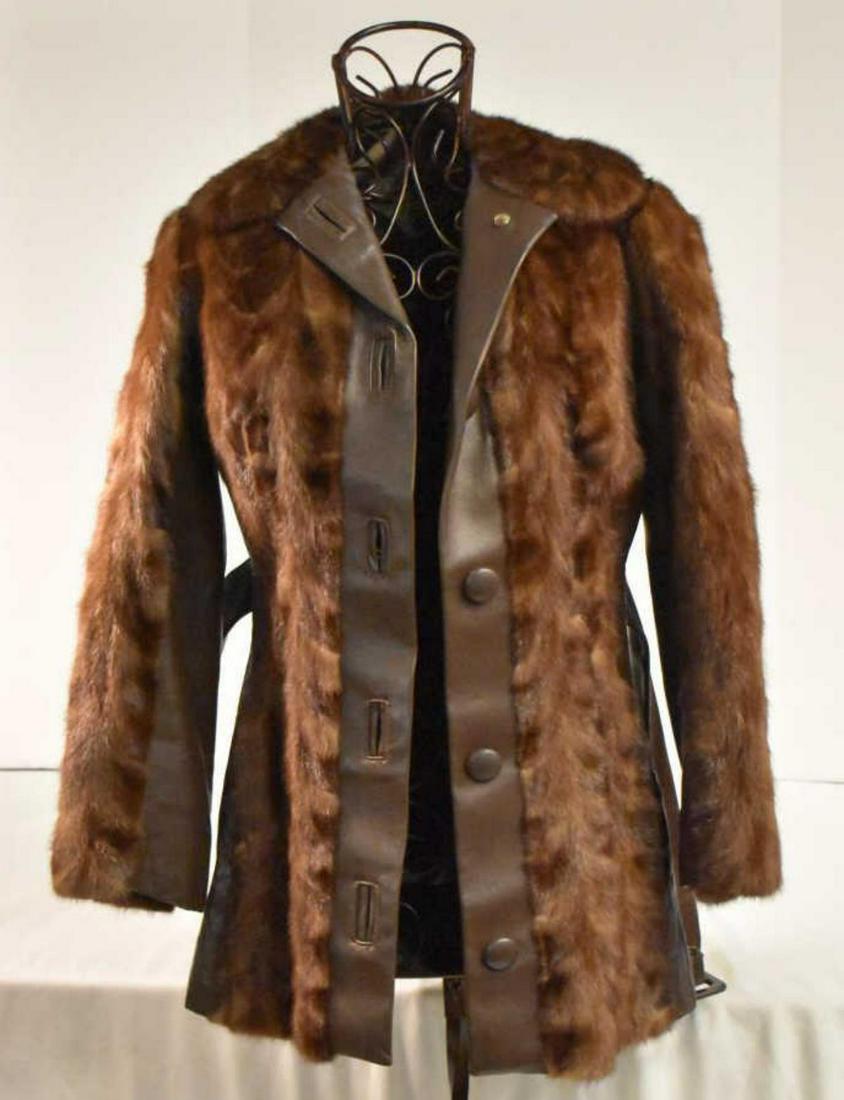 Mahogany Mink Coat With Leather Insert: Mahogany Mink Coat With Leather Insert. Kimble Furs. Bremen Indiana. Comes with leather belt. Measures 19" shoulder to shoulder. Measures 29" shoulder down. Measures 17" from inside arm to wrist.