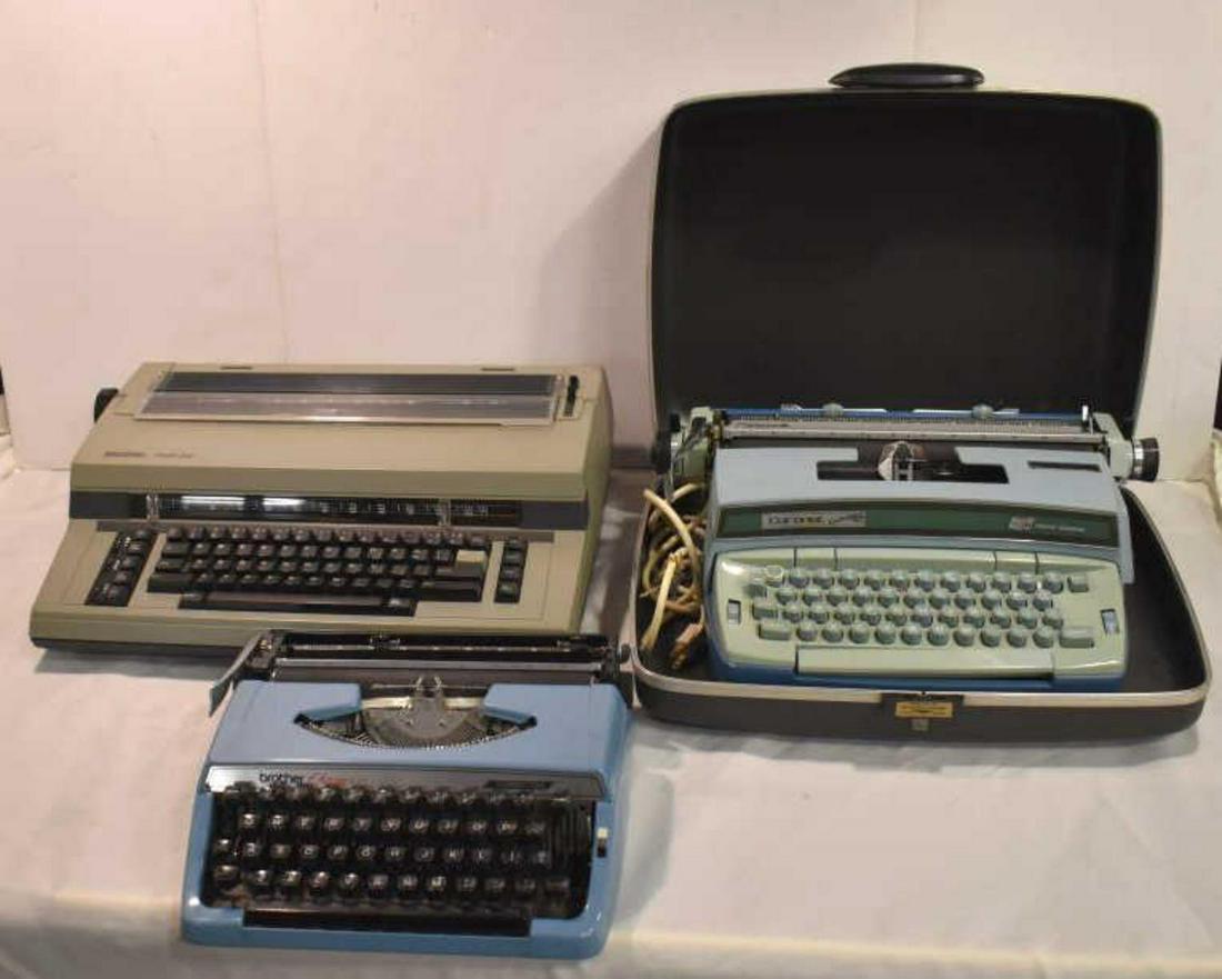 Trio Of Typewriters: Trio Of Typewriters. Consists of Brother Charger 11 Typewriter. Light blue color. Correction portable manual typewriter with carrying case. Measures 11" in diameter. Early 80's model. Comes in a case.