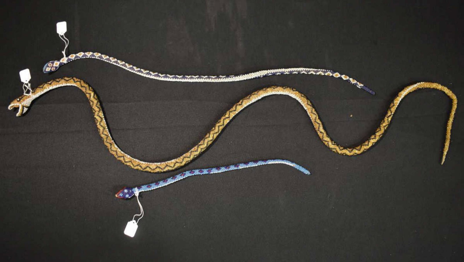 Group Of Turkish Prisoner's Beadwork Snakes: Group Of Turkish Prisoner's Beadwork Snakes. Total of 3 in the group. Sizes range from 14 1/2"-51" long. Hand crafted by Turkish prisoners to help them bye time and earn some money while in prison. Co