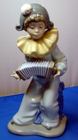 Nao by Lladro Fig. of Clown Playing Accordion: Nao by Lladro Fig. of Young Clown Playing Accordion, 8" tall, no chips or cracks.