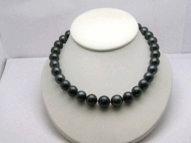 18" strand Black Tahitian Pearls: Princess strand of black Tahitian pearls graduated 12-15mm high lustre, good uniformity 18" in length with 14kwg plunger clasp.
