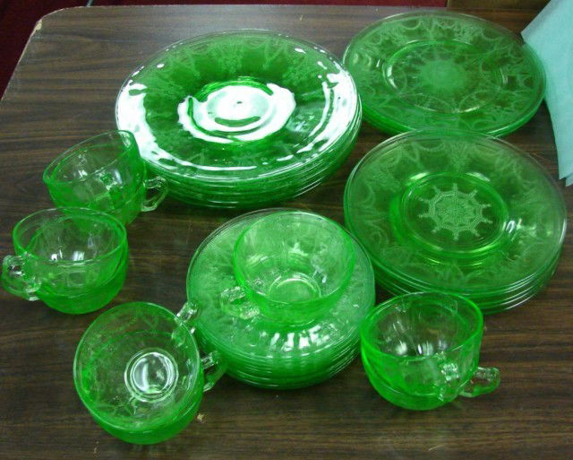 32 pcs. Green Depression Glass Cameo: 32 pcs. green Depression Glass in pattern known as Cameo, Ballerina or Dancing Girl; 5 10" plates, 3 9.5" plates & 6 8" plates; 8 cups an 10 saucers. No chips that we see; all sold as is.