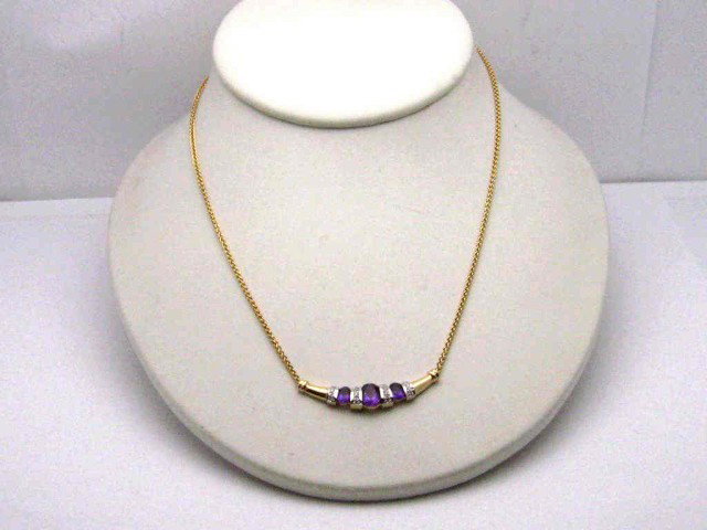 14kyg amethyst & diamond necklace: 14ky amethyst and diamond necklace 7.4gr with three oval shaped amethyst .80ctw channeled with pave diamond bars chevron style 16" in length.