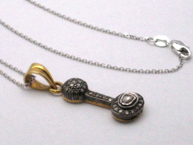 18kyg rosecut diamond necklace.60ctw: Vintage 18kyg diamond necklace 4.4gr with rosecut diamonds prong set in an hour glass design with black antiquing, 20" wg chain.