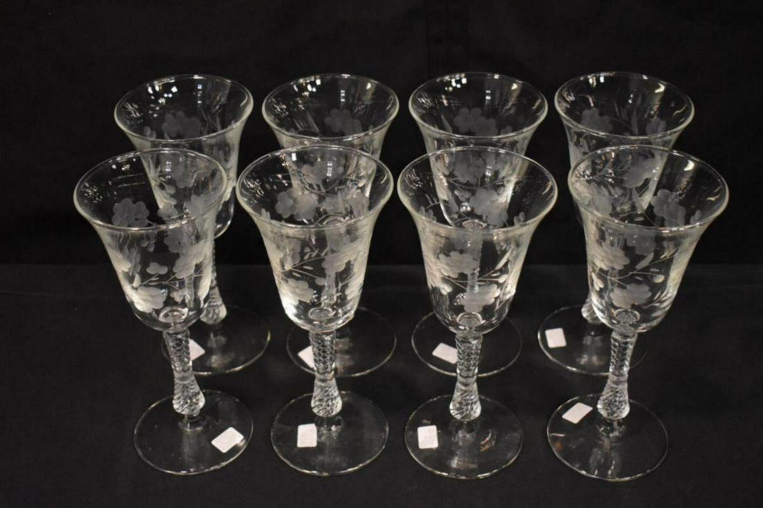 Group Of Etched Floral Ribbed Wine Glasses: Group Of Etched Floral Ribbed Wine Glasses. Total of 8 glasses in the group. Measures 8" tall. Frosted floral pattern through out the wine glass.