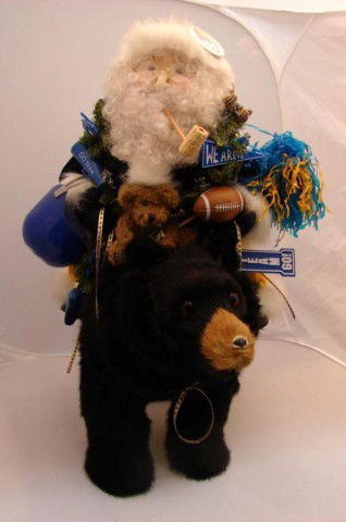 University of Michigan Mink Bear & Santa: University of Michigan custom made bear, made from genuine mink, with Santa wearing U of M colors, approx. 20" high x 18" long. Excellent condition.