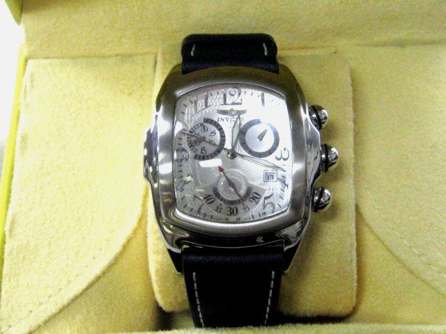 Invicta Lupah stainless watch: Invicta Lupah chronograph watch, stainless steel with swiss movement,dive to 100m and leather stitched band. Comes with original box.