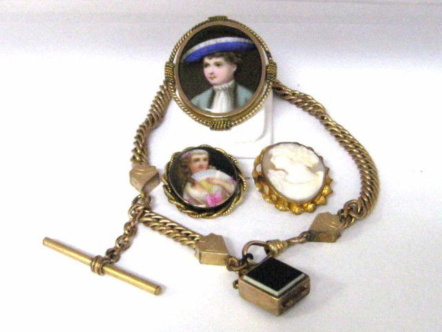 Portrait pins,watch fob & cameo: 2 gold plate portrait pins, small cameo and gold filled watch fob with intaglio locket.
