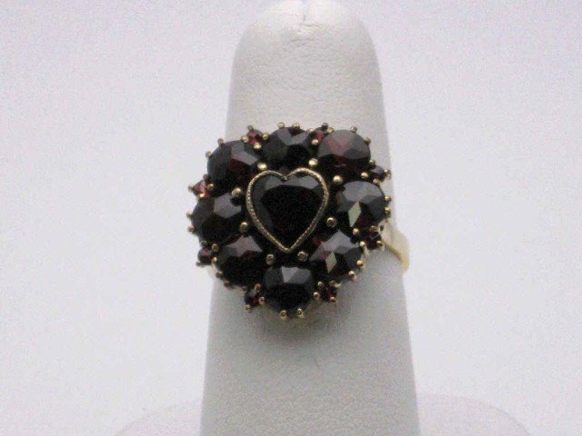 Vintage heart shaped garnet ring in 10kyg: Vintage garnet ring in 10kyg 4.6gr with round shaped garnet, prong set in a heart design along with heart shaped garnet in the center 2.50ctw finger size 63/4.