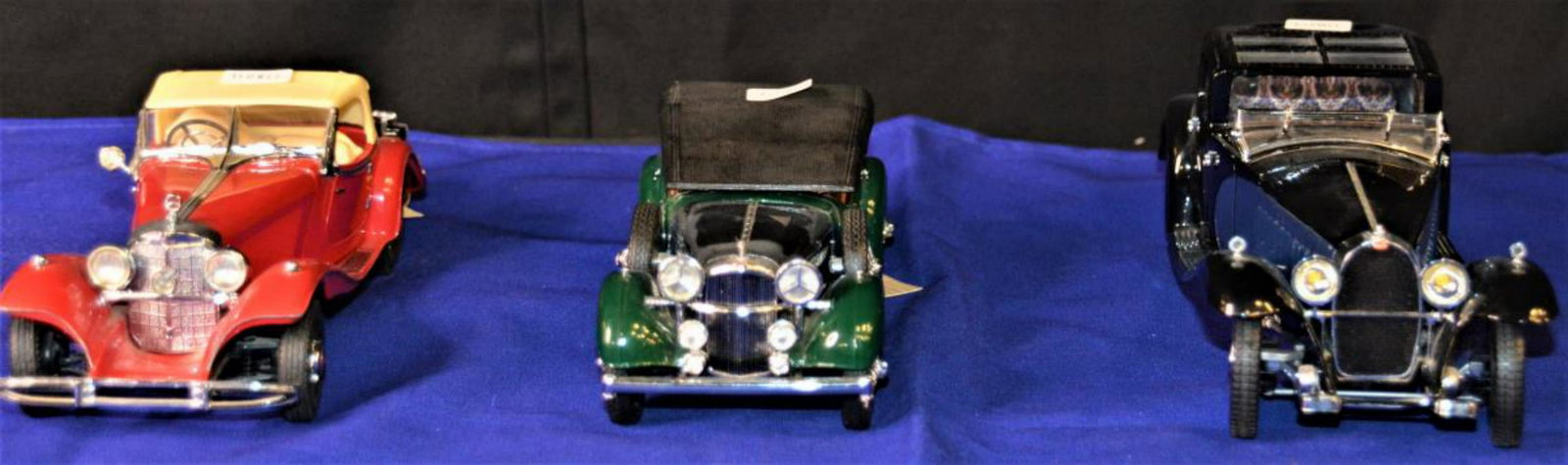 Trio Of Franklin Mint Die Cast Cars: Trio Of Franklin Mint Die Cast Cars. Comes with brochure and paperwork on a couple of the die cast cars. Consists The 1930 Bugatti Royale Coupe Napoleon. Measures 9 1/2" in diameter. Some pieces missi