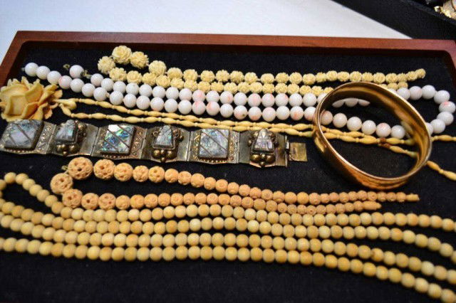 Lot of angel skin coral, ivory, sterling jewelry: Lot contains angel skin coral, bone and carved ivory necklaces, sterling and abalone bracelet and vintage bangle.