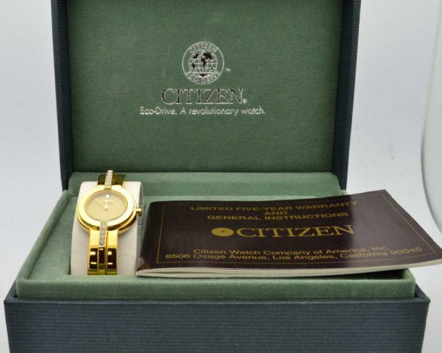 Lady's Citizen Eco-Drive watch: Lady's Citizen Eco-Drive fashion watch, water resistant, bangle design with adjustable links. Never been worn! Comes with box and papers.