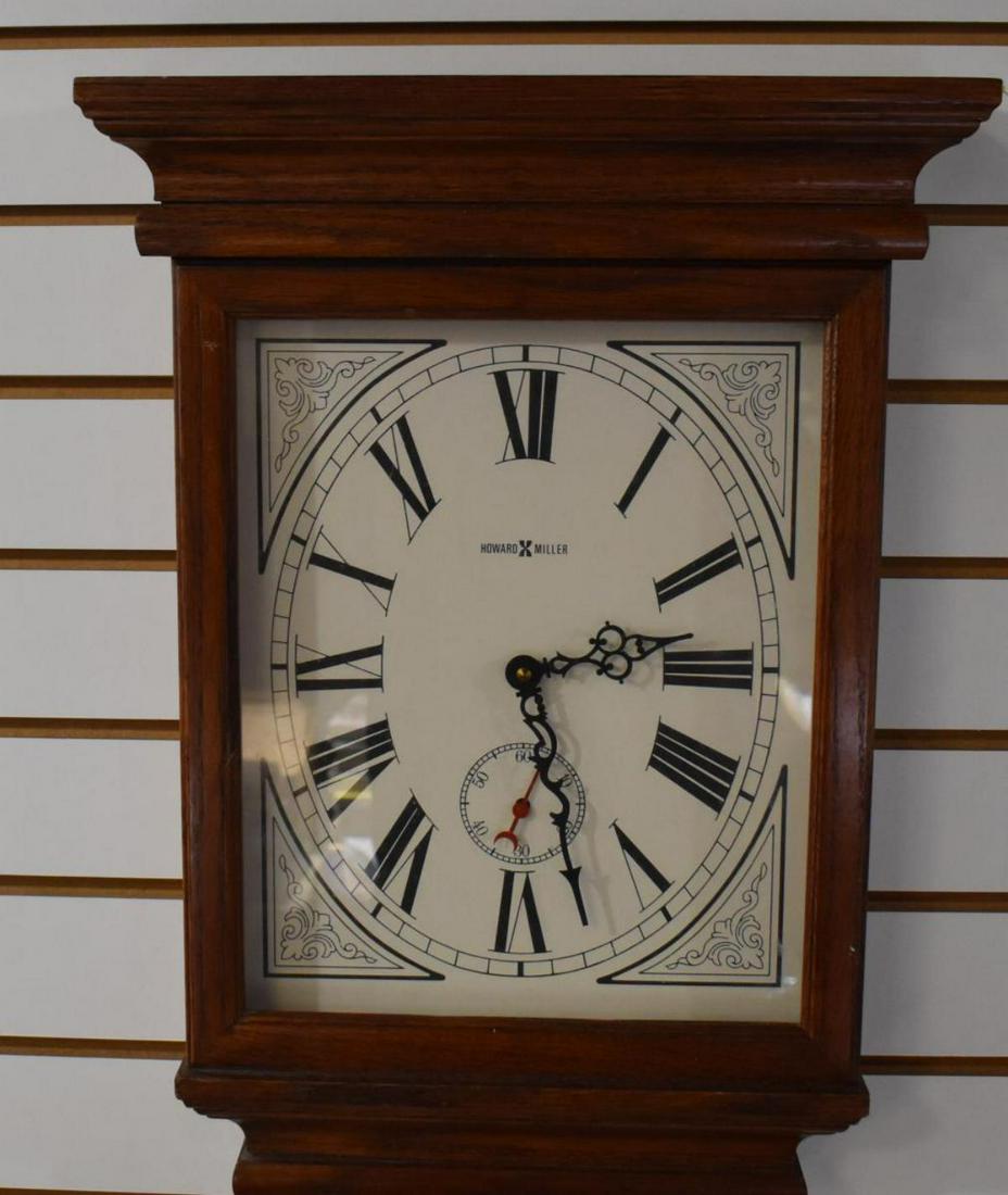Howard Miller Clock: Howard Miller Clock. Model Number 613-239. The Fables Wall Clock by Howard Miller. Finished in Oak Yorkshire. Moldings on the top and base. Decorative dial with rich brown roman numerals. Separate sec
