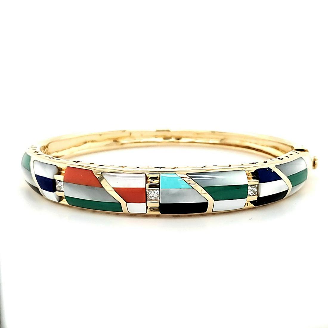 14kt yellow gold Asch-Grossbardt inlayed bracelet: Ladies 14kt yellow gold Asch-Grossbardt inlayed stone bangle bracelet inlayed mother of pearl, onyx, lapis lazuli and malachite set in a geometric pattern. Accented with channel set princess cut diamo