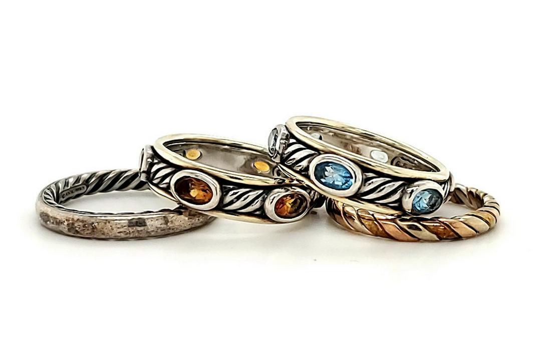 Group of 4 David Yurman fashion bands: Group of 4 ladies David Yurman fashion bands including a two tone band with bezel set citrine, two tone band with bezel set blue topaz, a twisted cable sterling silver band and tri-color twisted cable