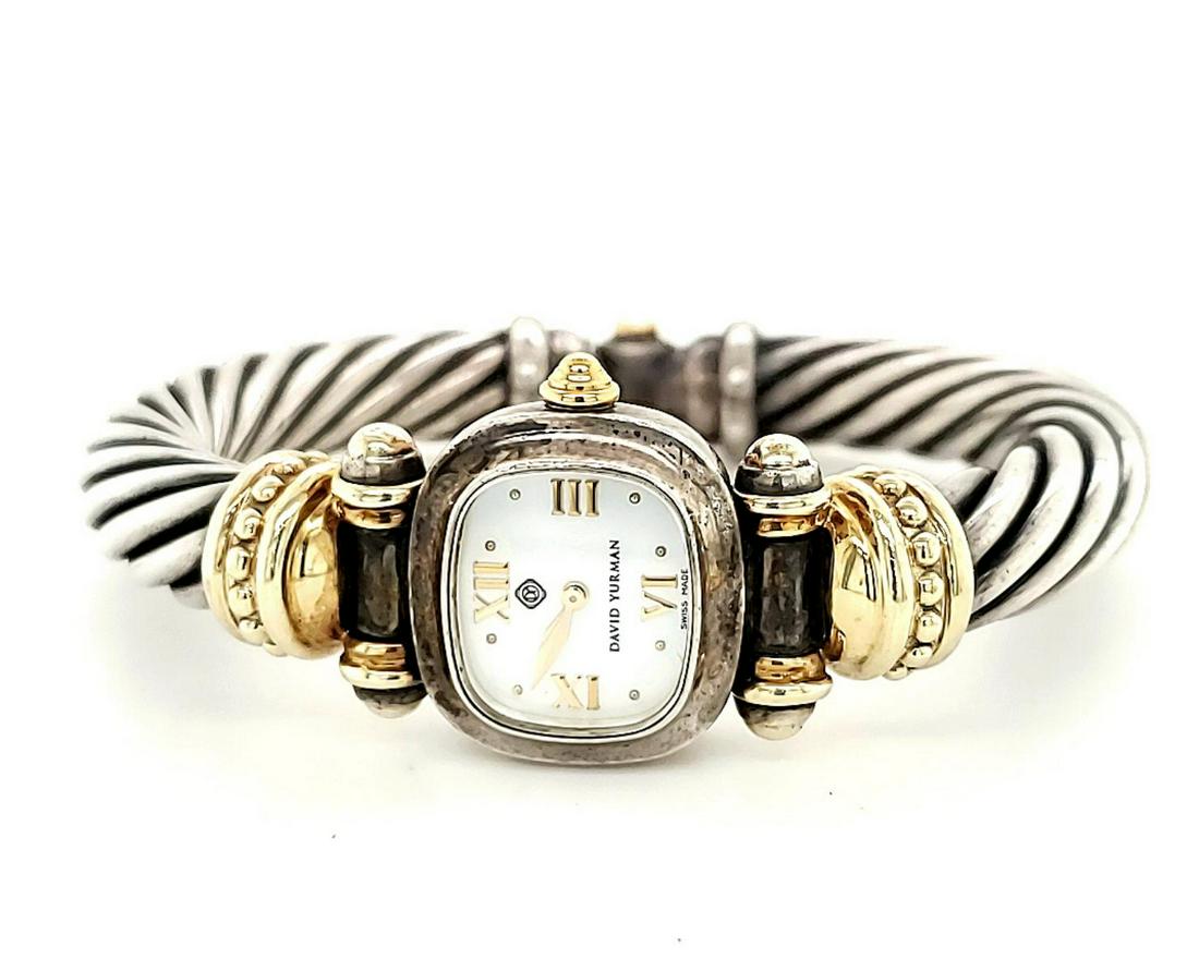 Sterling and 14kt David Yurman Cable Watch: Ladies sterling silver and 14kt David Yurman Cable watch featuring a rectangular mother of pearl dial, quartz movement, 14kt yellow gold beaded design lugs and signature twisted cable bangle bracelet.