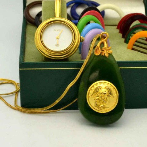 Lady's Gucci watch and Marine pendant: Lady's Gucci watch with changeable colored bezels and jade Marine pendant with 20" chain. Some wear on watch.